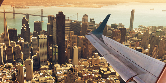 Travel Program Consolidation: view of aeroplane wing from window