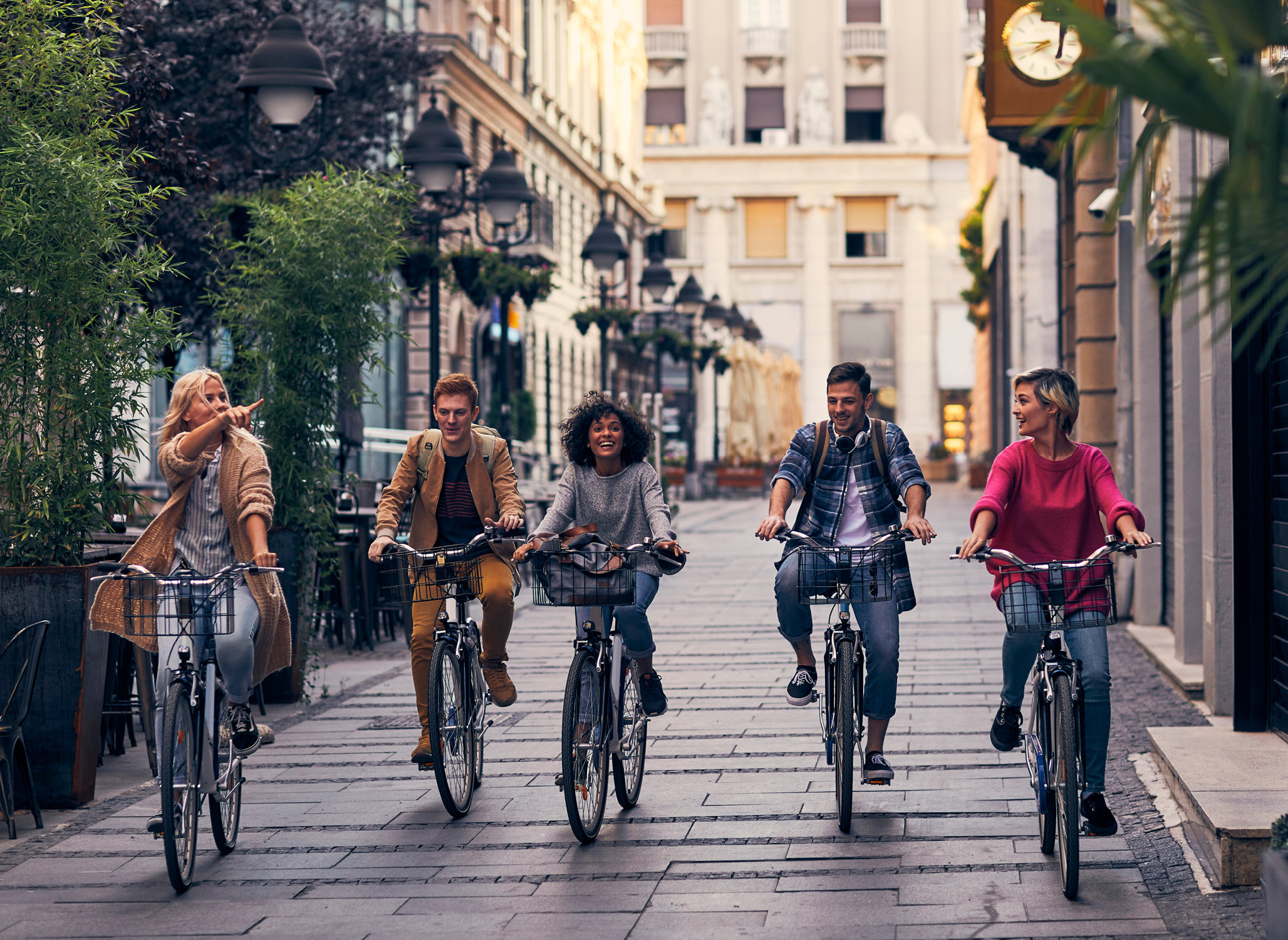 Group of incentive winners riding bikes through the streets