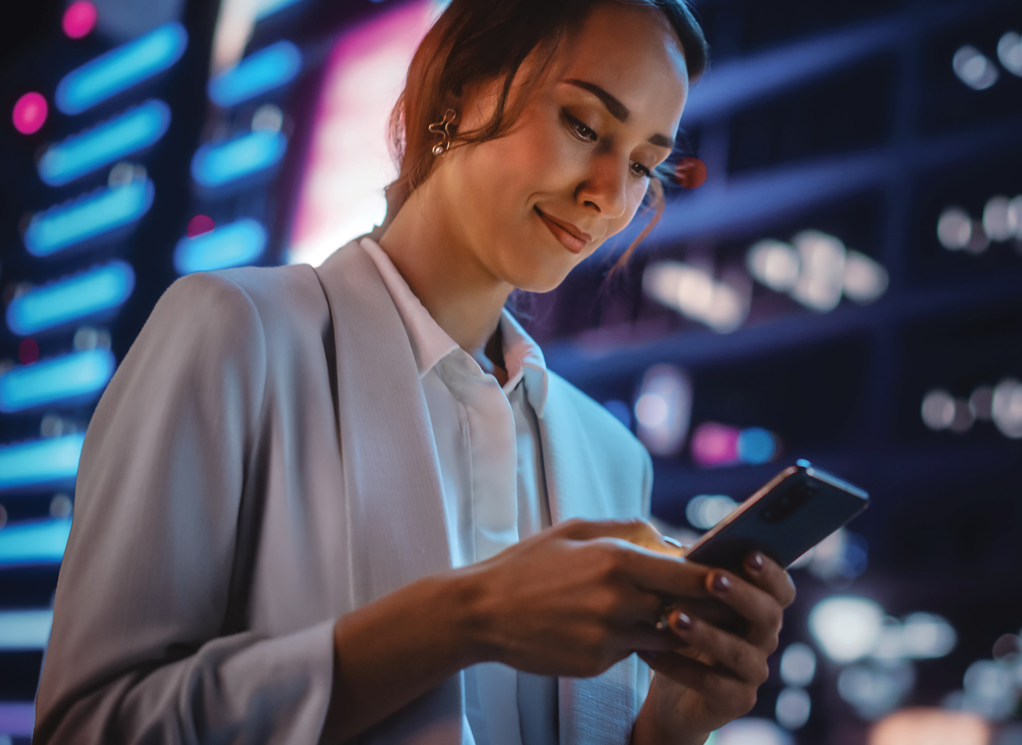 Business women looking at her mobile.