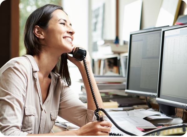 Travel arranger speaking on phone