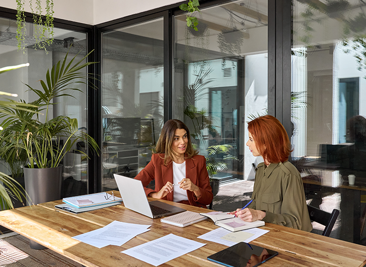 Woman talking to customer to gauge satisfaction