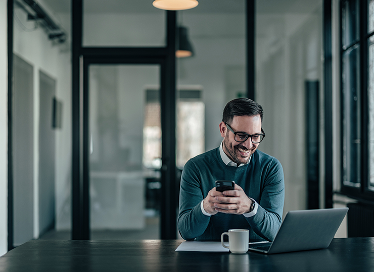Business man creating online adoption goals on laptop